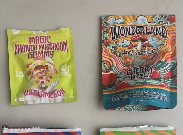Packaging of psychedelic mushroom gummies: Magic Amanita Mushroom Gummy in watermelon flavor and Wonderland Legal Psychedelics Cherry Nirvana gummies, highlighting the rise of mushroom edibles marketed as legal psychedelics despite safety risks