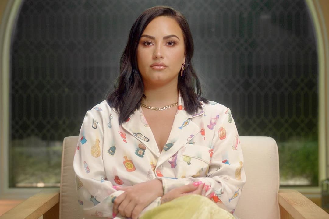 Demi Lovato, featured in her documentary 'Dancing with the Devil,' reveals the aftermath of her 2018 overdose. The image shows her sharing her personal journey of recovery from heroin and fentanyl overdose, including the lasting effects of brain damage, strokes, and vision loss